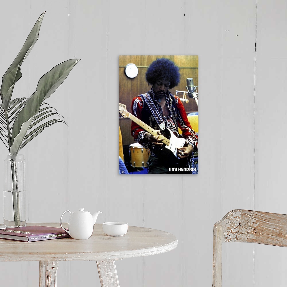 A farmhouse room featuring Vintage color photograph of the musician Jimi Hendrix strumming an electric guitar and wearing a ...