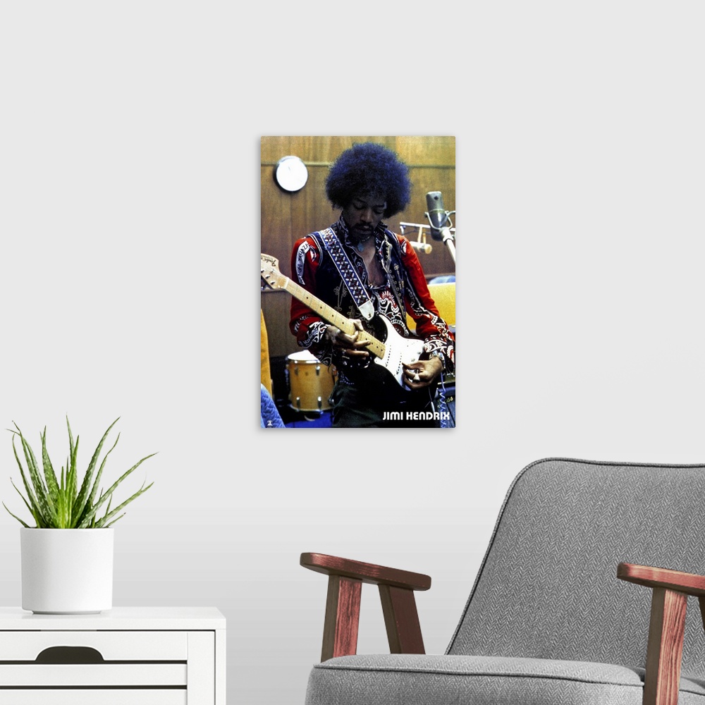 A modern room featuring Vintage color photograph of the musician Jimi Hendrix strumming an electric guitar and wearing a ...