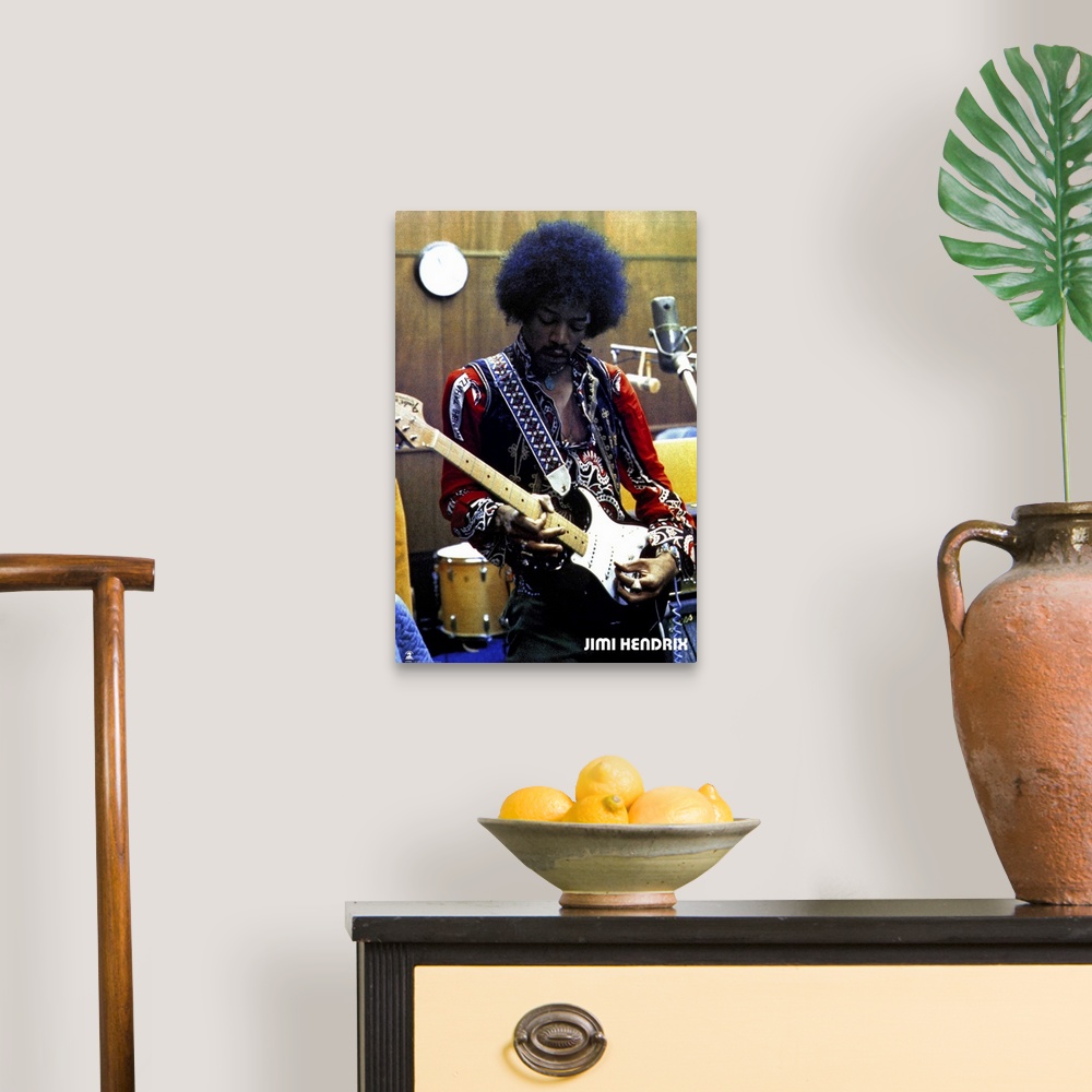 A traditional room featuring Vintage color photograph of the musician Jimi Hendrix strumming an electric guitar and wearing a ...