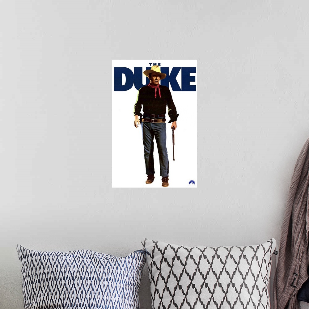 A bohemian room featuring Movie poster advertising the 1971 movie The Duke starring John Wayne.