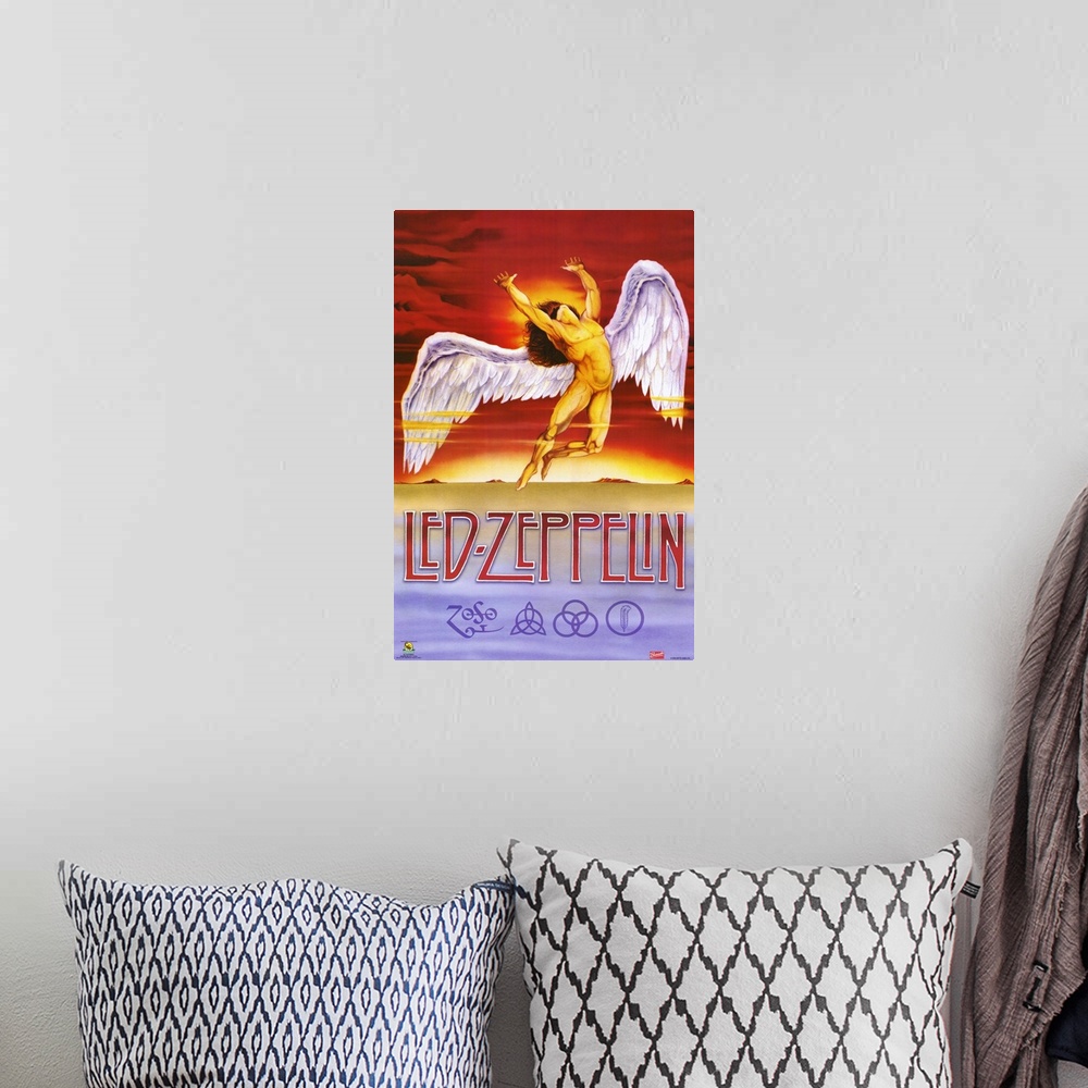 A bohemian room featuring Vertical, oversized artwork for Led Zeppelin, a muscular, nude, human figure with large wings fly...