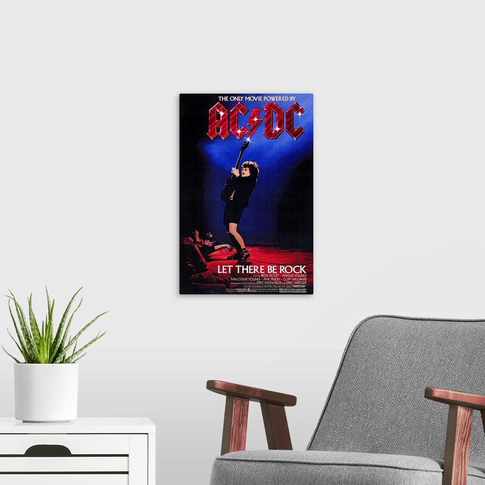 A modern room featuring Poster for the movie titled "Let There Be Rock". It shows a guitar player at the edge of the stag...