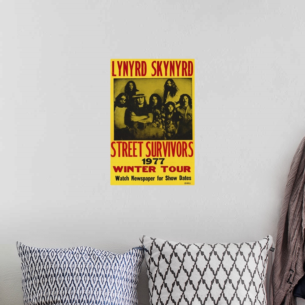 A bohemian room featuring Vintage poster for American rock band's tour "Street Survivors."  The band was popular for promot...