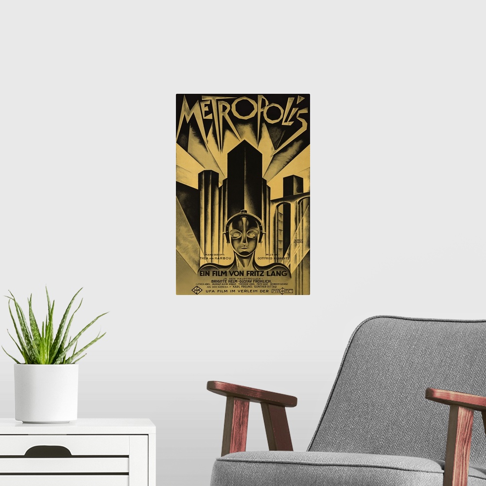 A modern room featuring Poster for the 1927 science fiction film Metropolis. Skyscrapers line the back of the poster with...