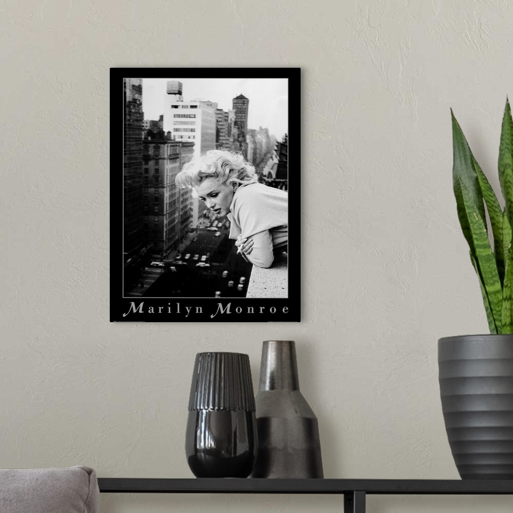 A modern room featuring Vintage poster of American actress, model, and singer Norma Jeane Mortenson looking over the ledg...