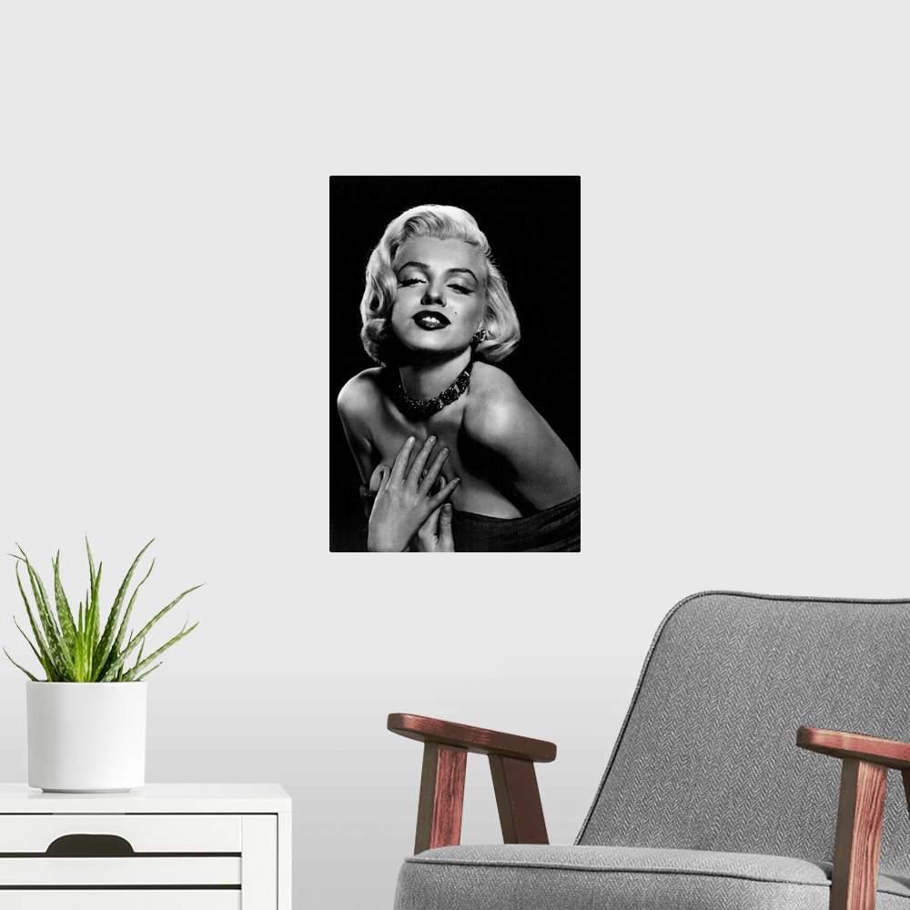 A modern room featuring Vintage black and white photograph of the actress leaning in and holding her hands to her chest, ...