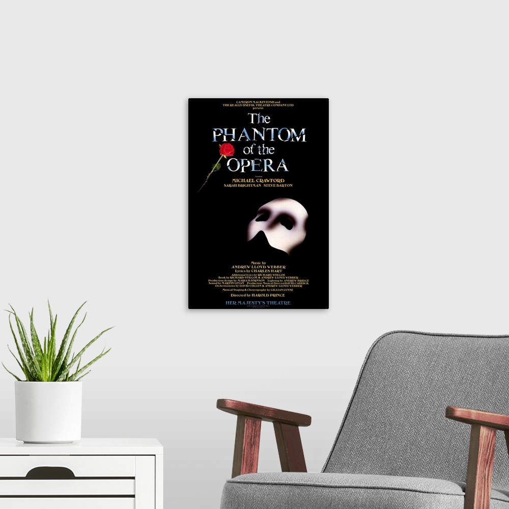 A modern room featuring Broadway poster for Andrew Lloyd Webber's play, The Phantom of the Opera, displaying the Phantom'...