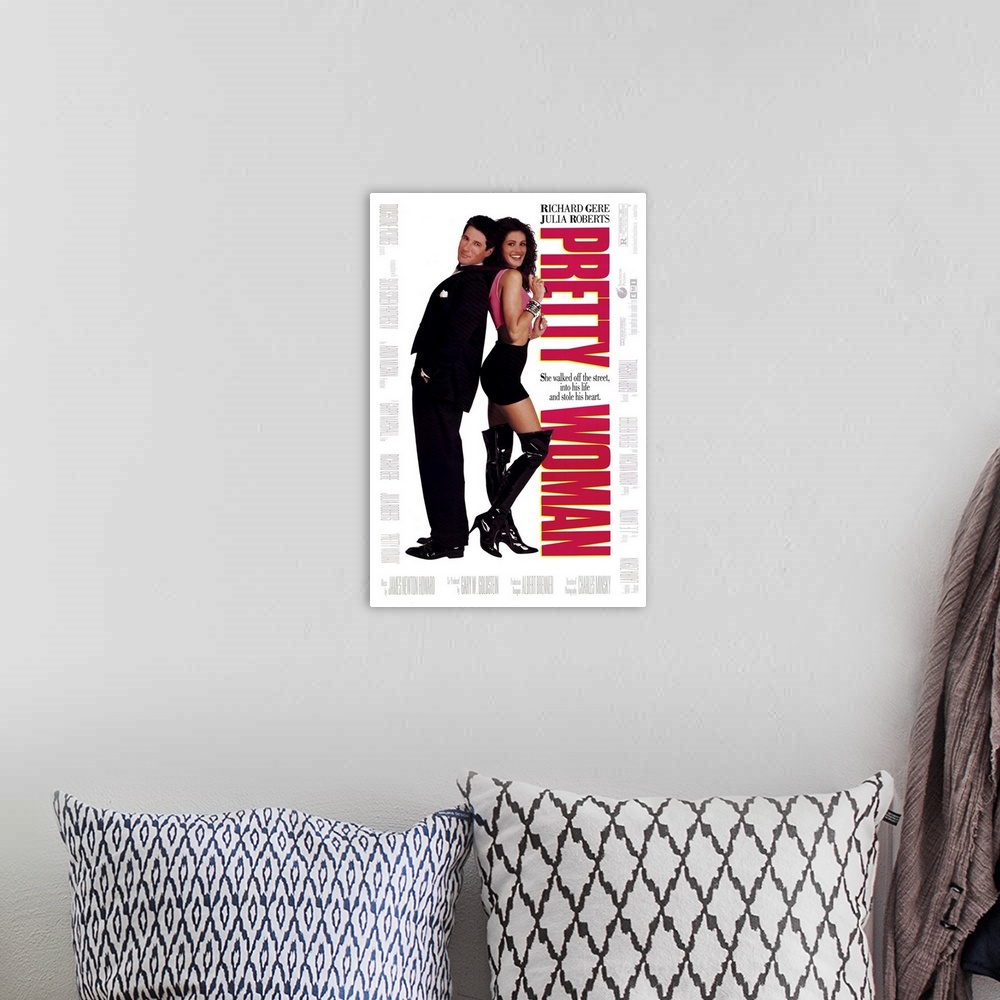 A bohemian room featuring Vertical, large movie advertisement for "Pretty Woman", with Julia Roberts and Richard Gere stand...