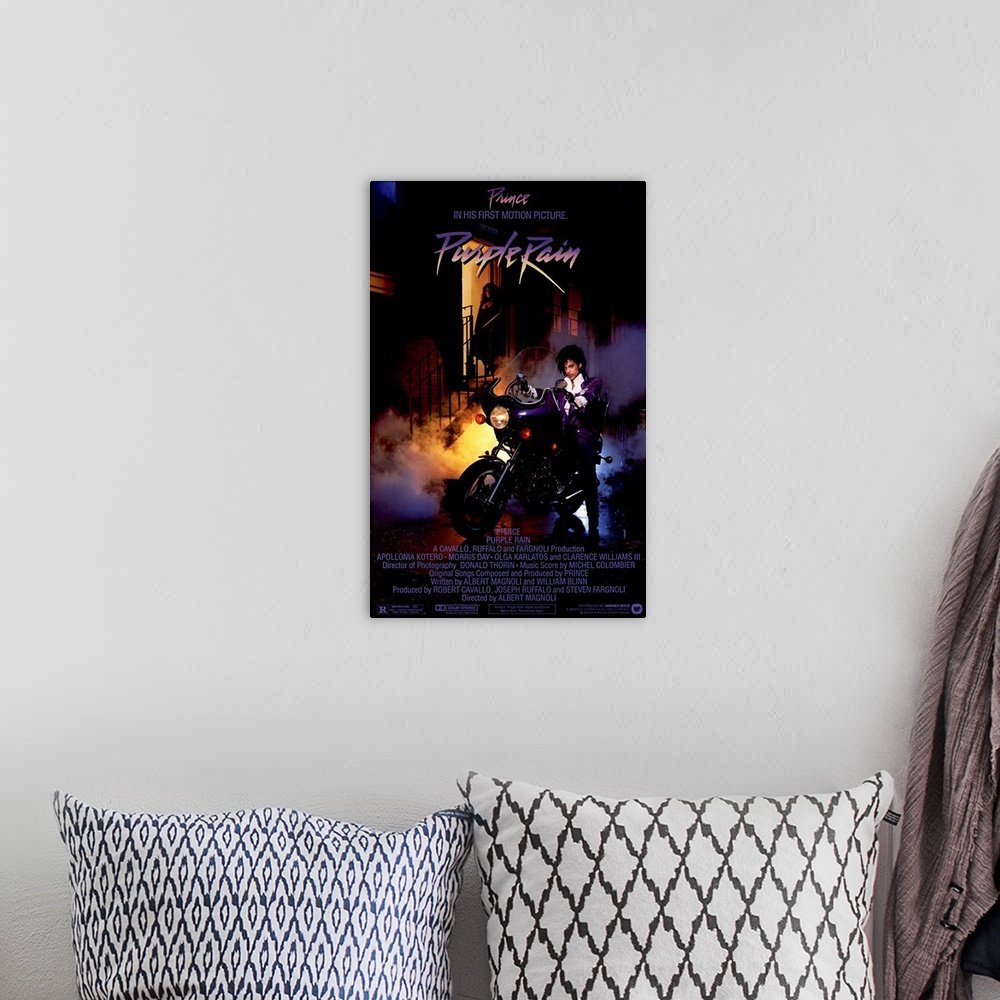 A bohemian room featuring Vintage movie poster for the movie Purple Rain featuring the music artist Prince with a picture o...