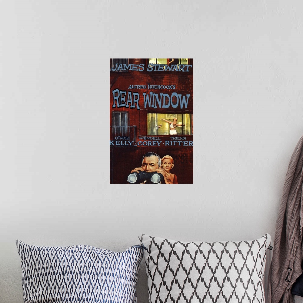 A bohemian room featuring Classic movie poster for Alfred Hitchcock's "Rear Window". It shows the main character with his b...