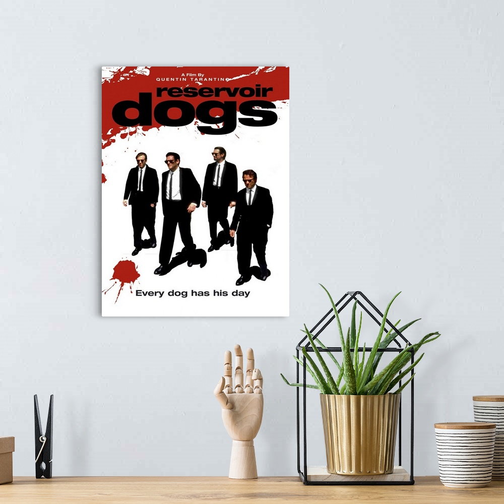 A bohemian room featuring Movie poster for "Reservoir Dogs". It has the four main characters walking in suits with splashes...