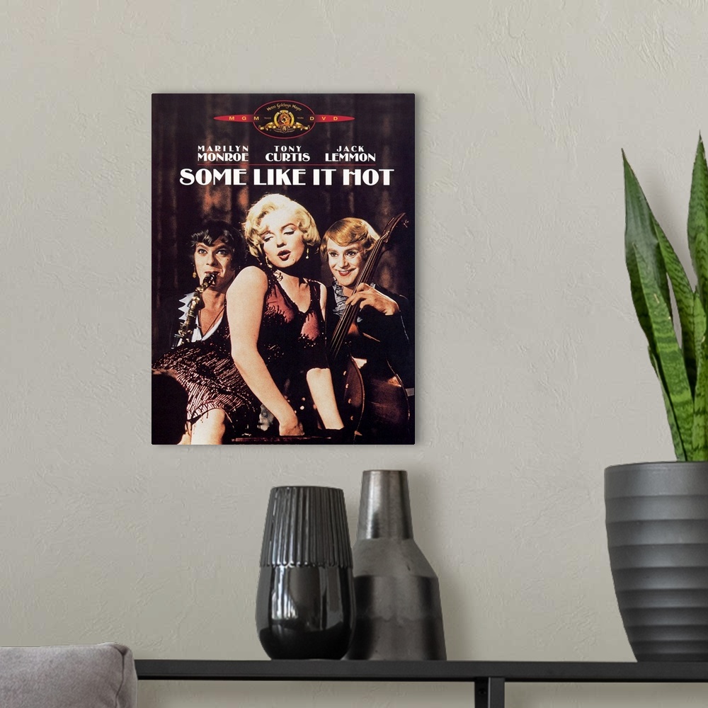 A modern room featuring Big, vertical movie advertisement for Some Like it Hot, the three stars, Marilyn Monroe, Tony Cur...