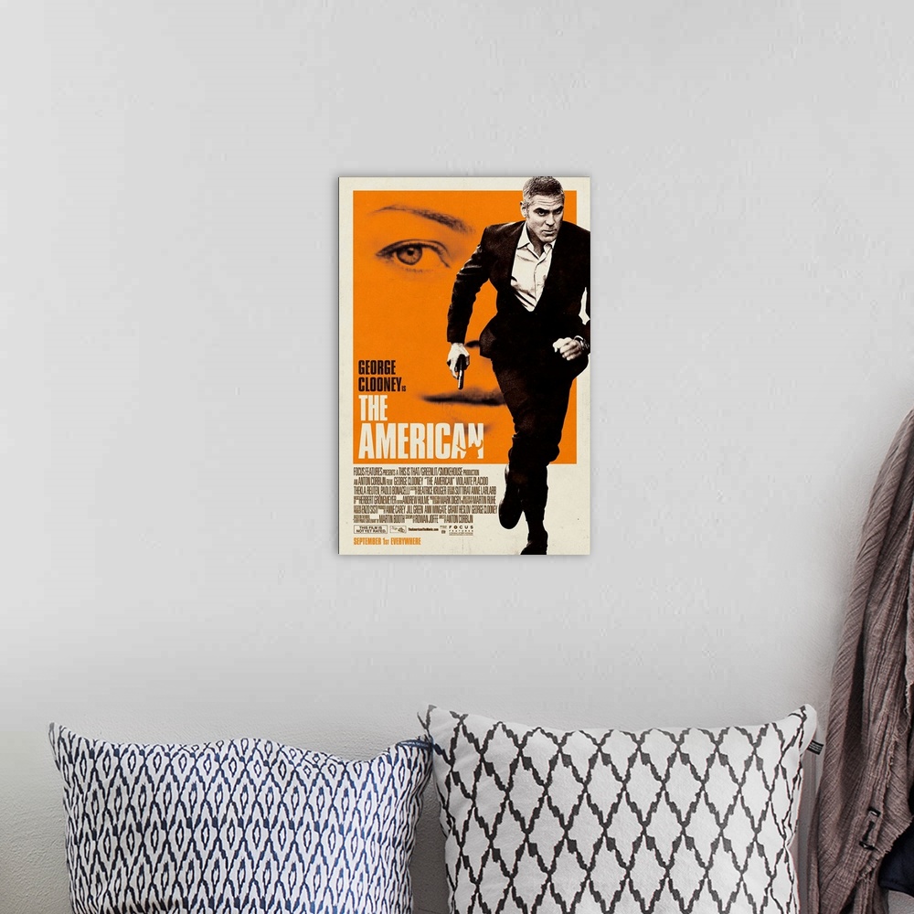 A bohemian room featuring The American - Movie Poster