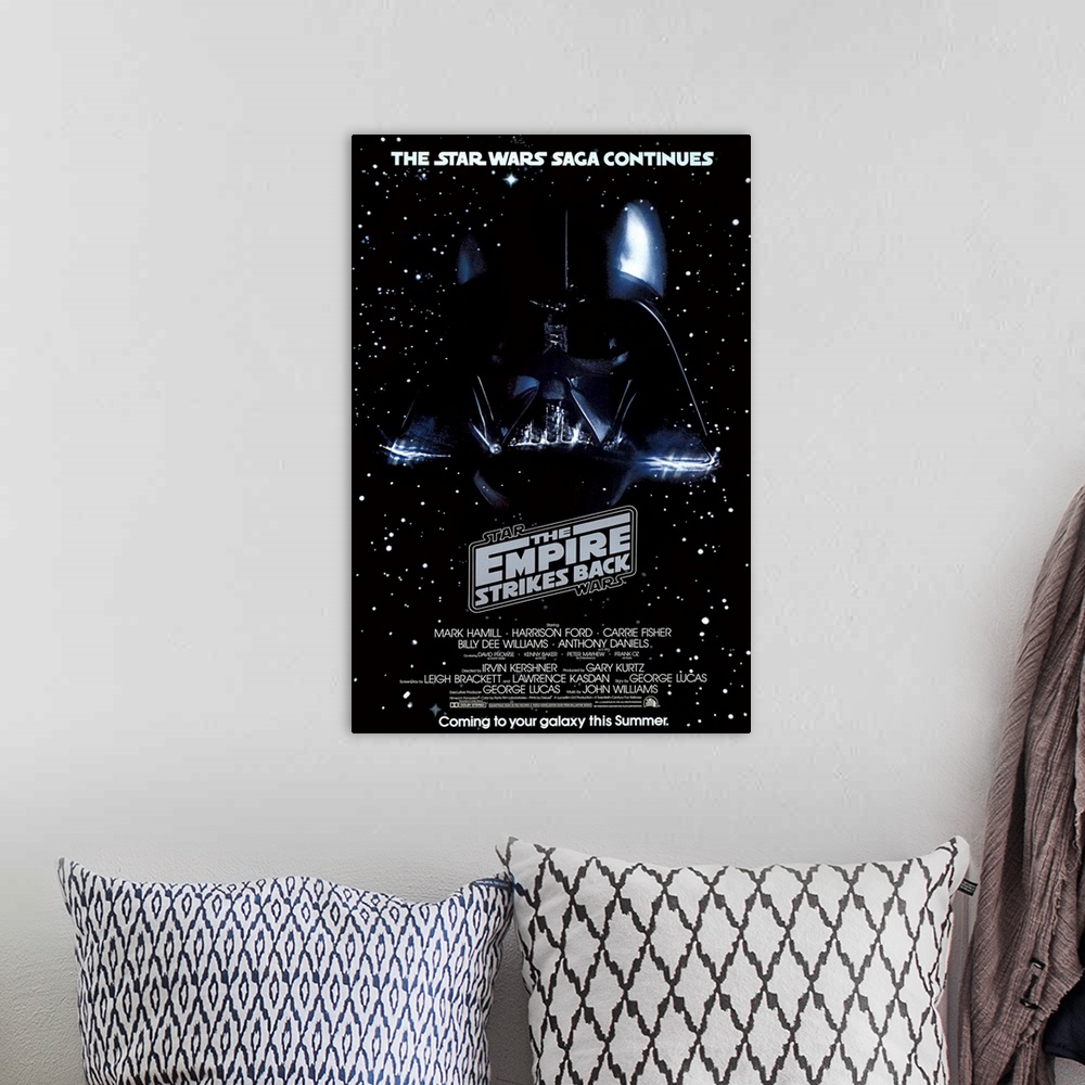 A bohemian room featuring Giant, vertical movie image on canvas for The Empire Strikes Back, with Darth Vader's head on a g...