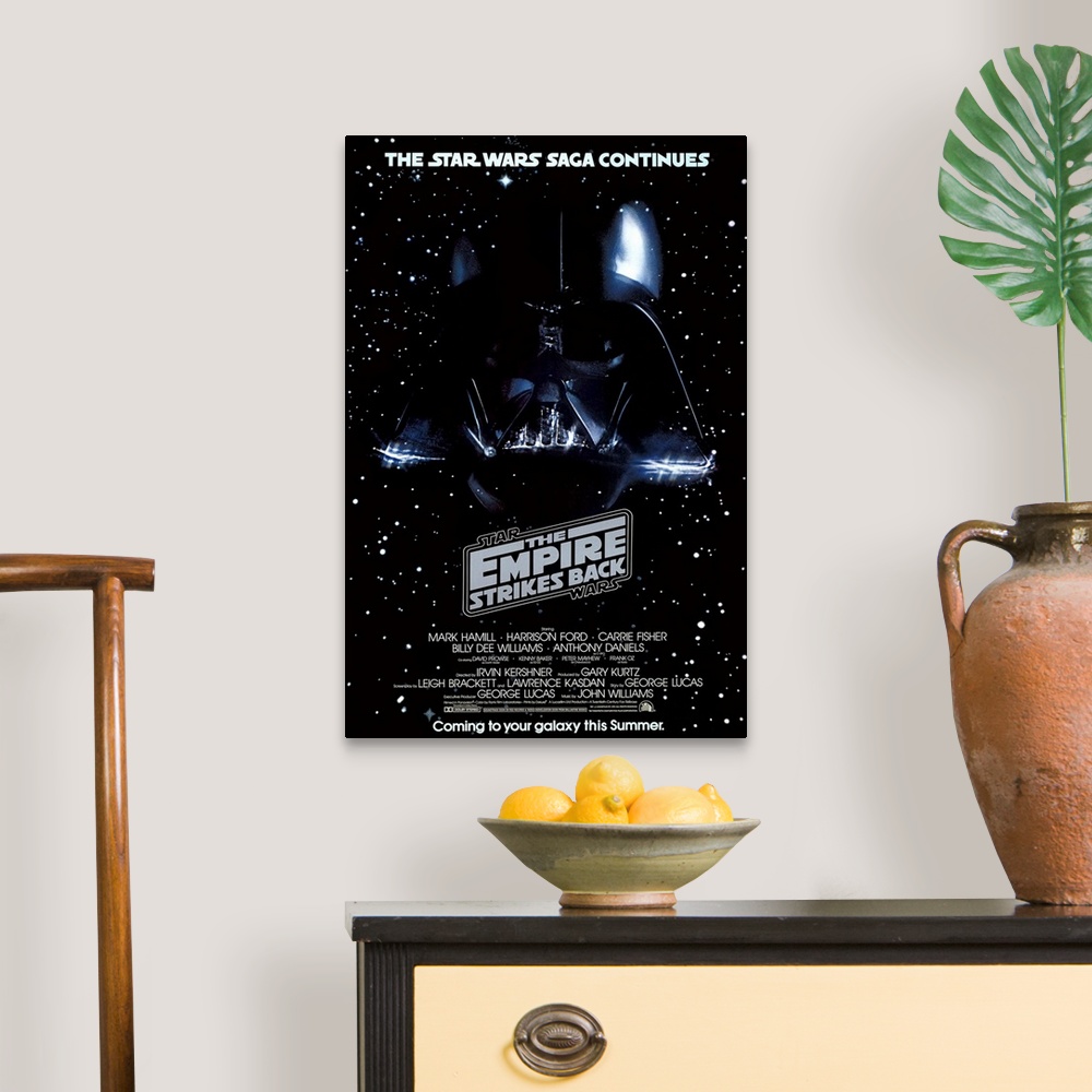 A traditional room featuring Giant, vertical movie image on canvas for The Empire Strikes Back, with Darth Vader's head on a g...