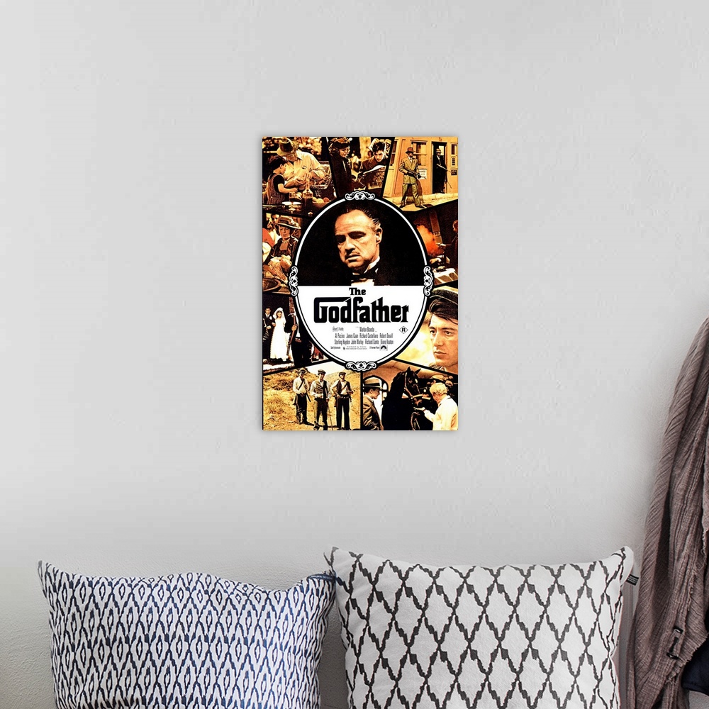 A bohemian room featuring Movie poster for "The Godfather" that has Marlon Brando in the center of the poster with a collag...