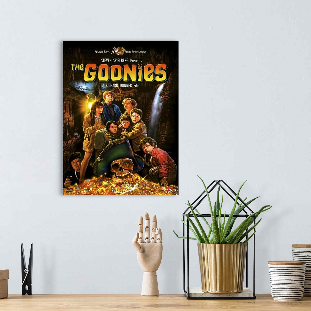 A bohemian room featuring Movie poster for the 1980s movie Goonies with a drawing of all the child characters standing with...