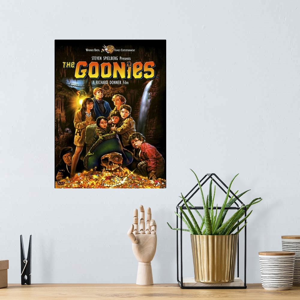 A bohemian room featuring Movie poster for the 1980s movie Goonies with a drawing of all the child characters standing with...
