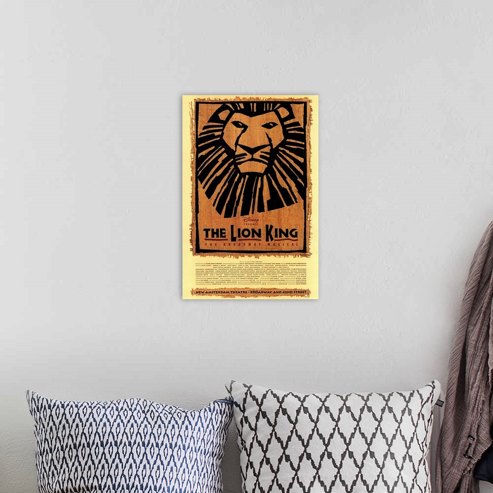 A bohemian room featuring Large canvas of a poster for The Lion King on Broadway.