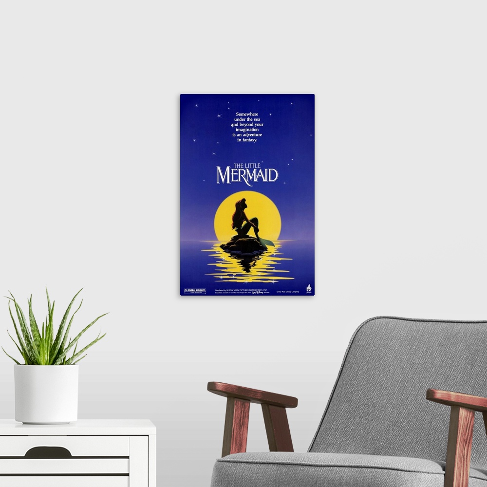 A modern room featuring Poster for the classic Disney movie "The Little Mermaid". Ariel sits on a rock in the ocean in fr...