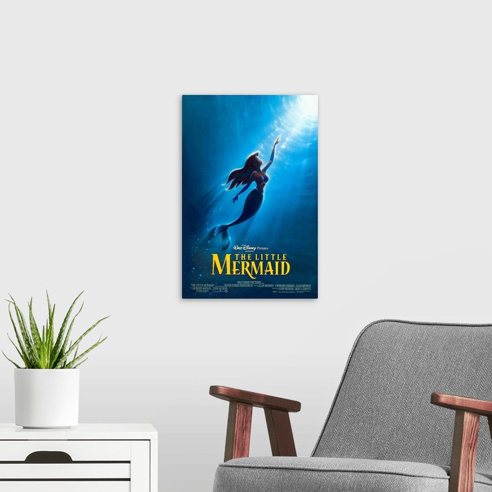 A modern room featuring Giant, vertical movie advertisement for the 1989 Walt Disney movie, The Little Mermaid.  Ariel sw...