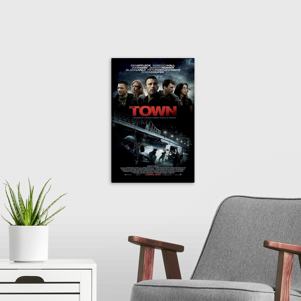 A modern room featuring The Town - Movie Poster