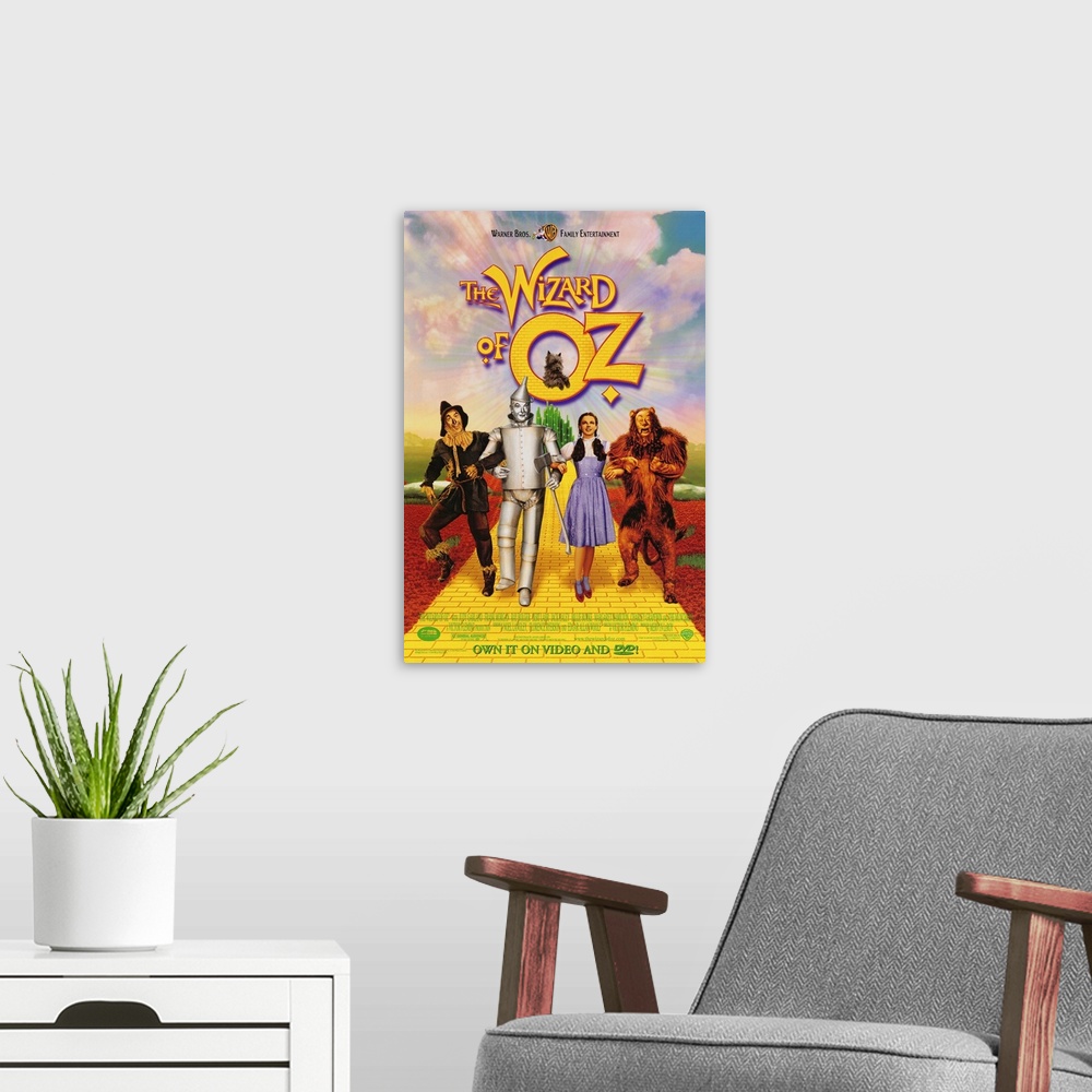 A modern room featuring Wall art of a classic movie with the Scarecrow, Tin man, Dorothy and the Cowardly Lion walking do...