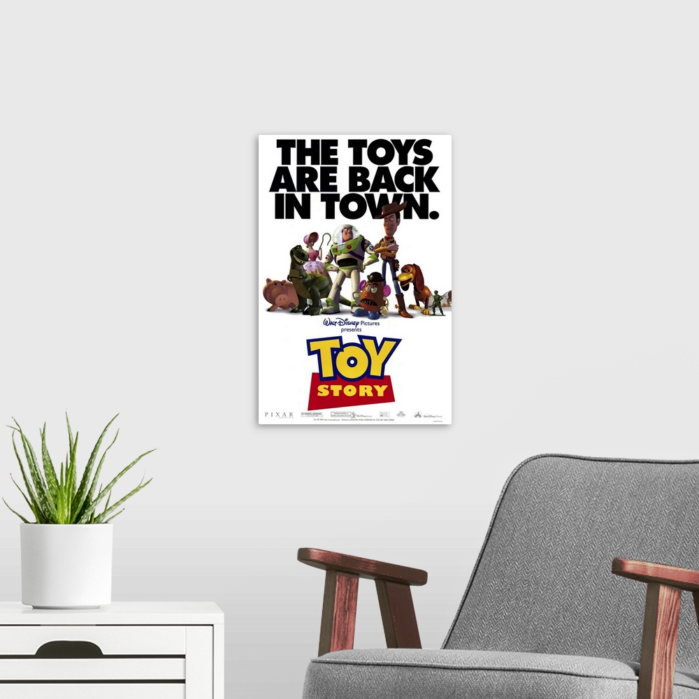 A modern room featuring Movie poster for Toy Story with all of the popular toys in the center of the poster and the text ...