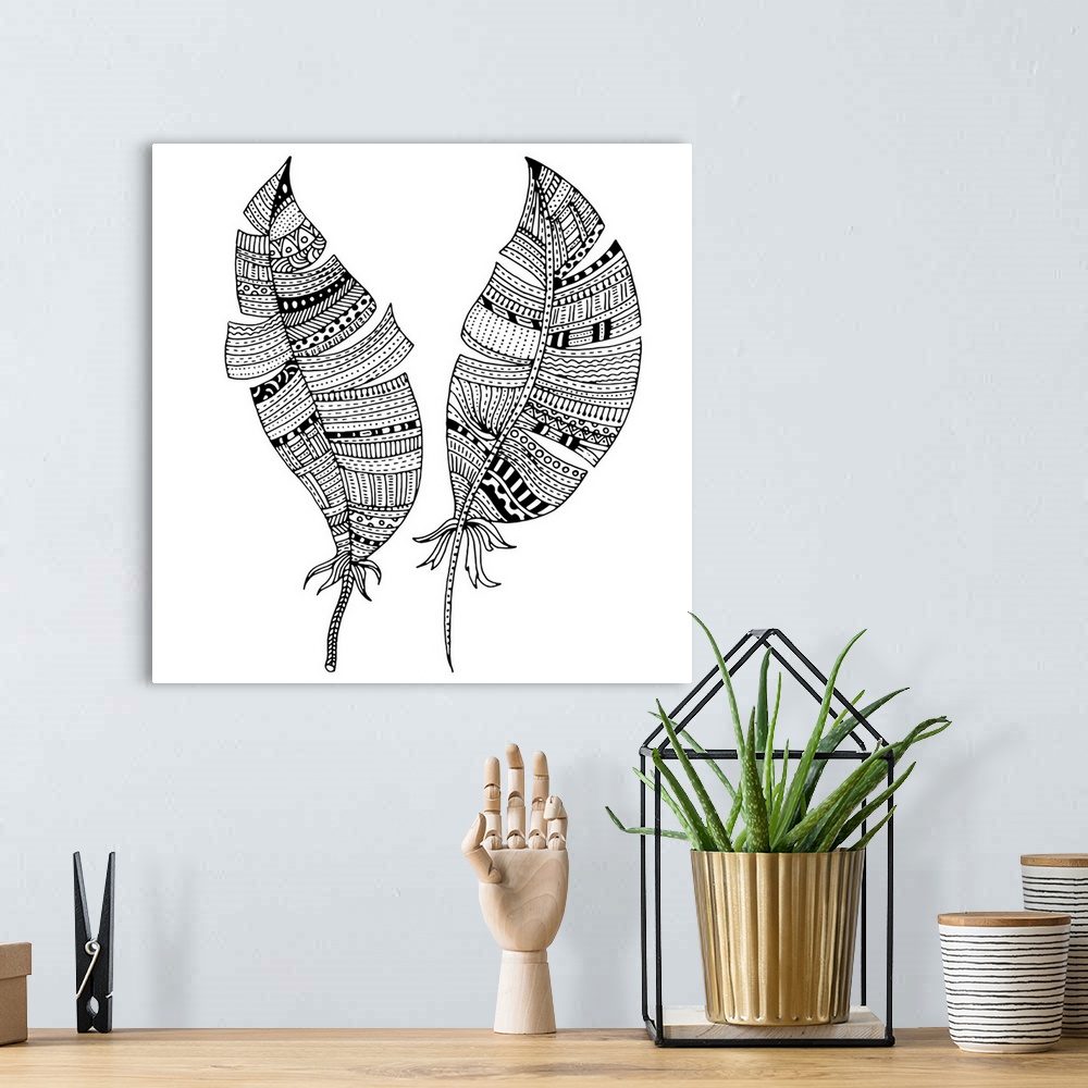 A bohemian room featuring Contemporary line art of two feathers with tribal patterns and designs against a white background...