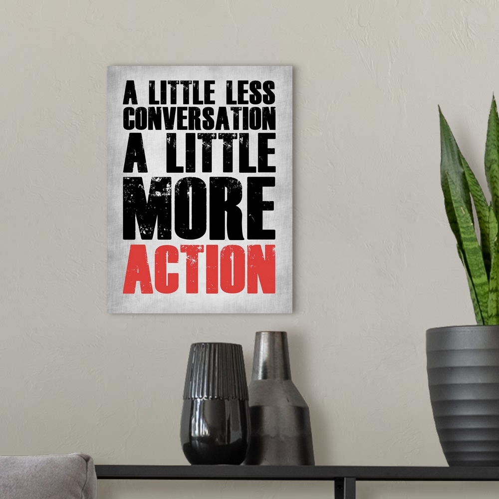 A modern room featuring A Little More Action Poster Grey