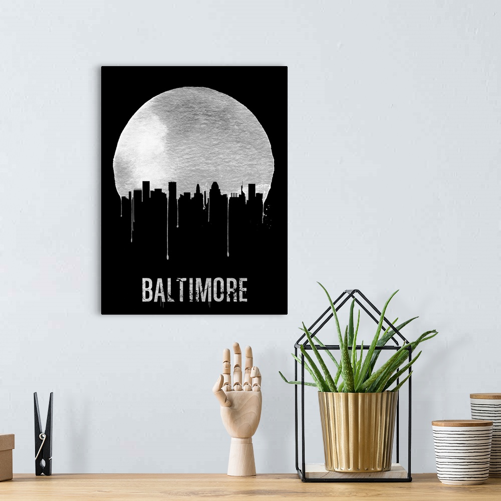A bohemian room featuring Contemporary watercolor artwork of the Baltimore city skyline, in silhouette.