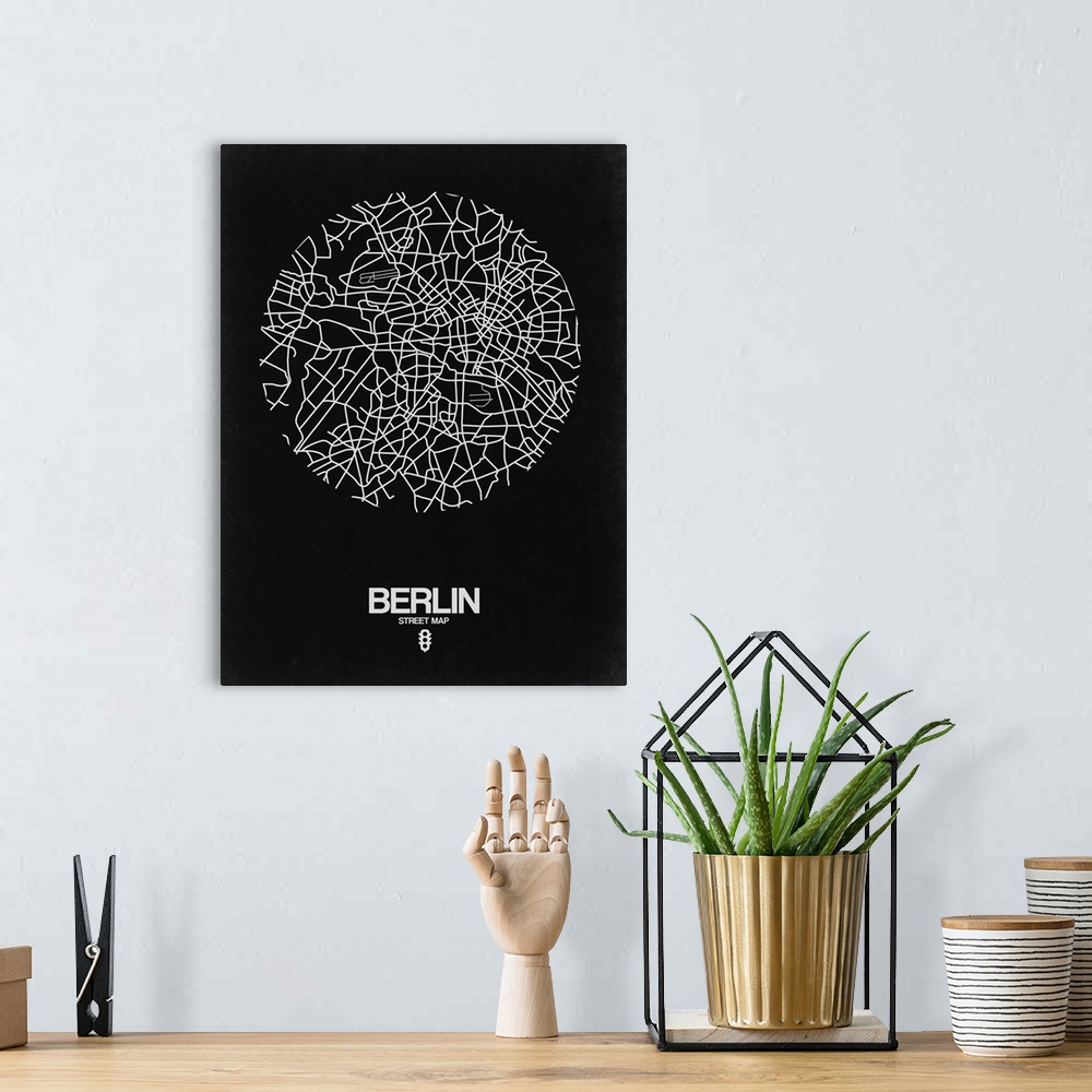 A bohemian room featuring Minimalist art map of the city streets of Berlin in black and white.
