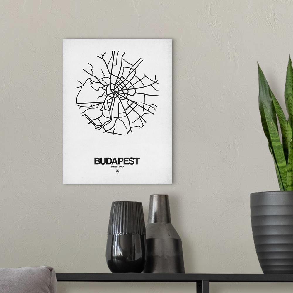 A modern room featuring Minimalist art map of the city streets of Budapest in white and black.