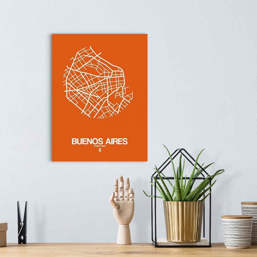 A bohemian room featuring Minimalist art map of the city streets of Buenos Aires in orange and white.