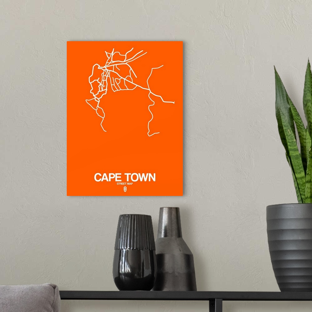 A modern room featuring Minimalist art map of the city streets of Cape Town in orange and white.