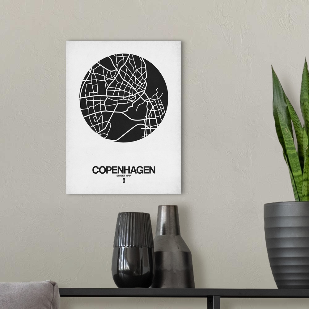 A modern room featuring Minimalist art map of the city streets of Copenhagen in white and black.