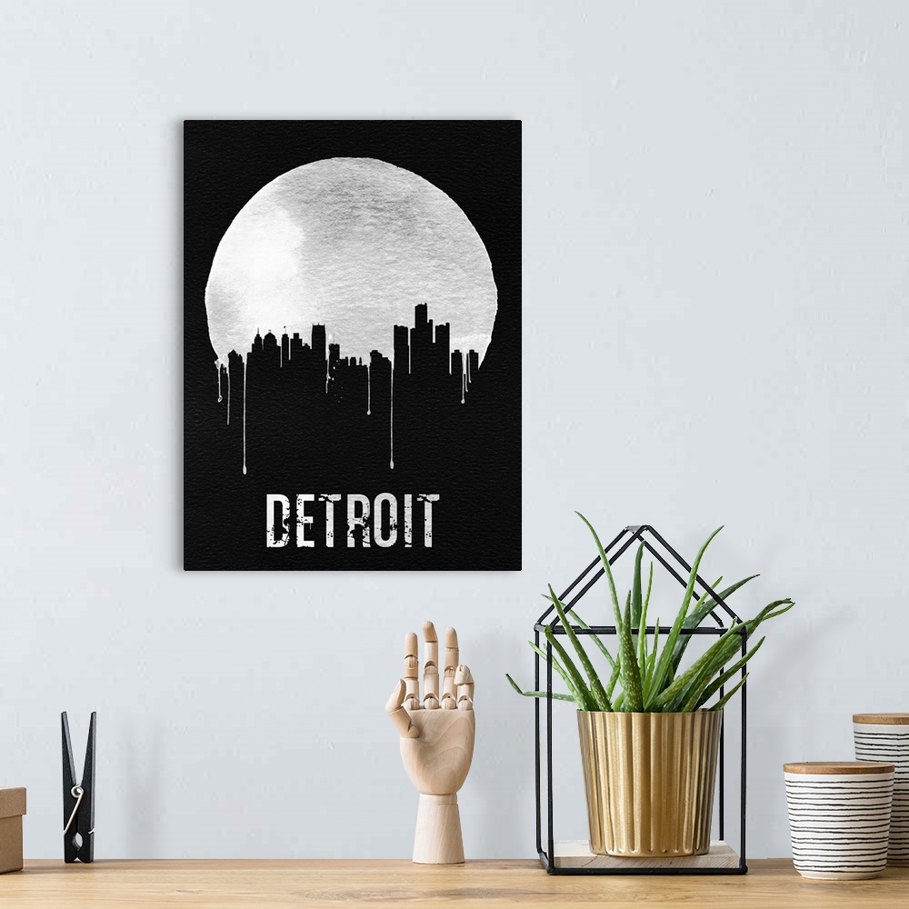 A bohemian room featuring Contemporary watercolor artwork of the Detroit city skyline, in silhouette.
