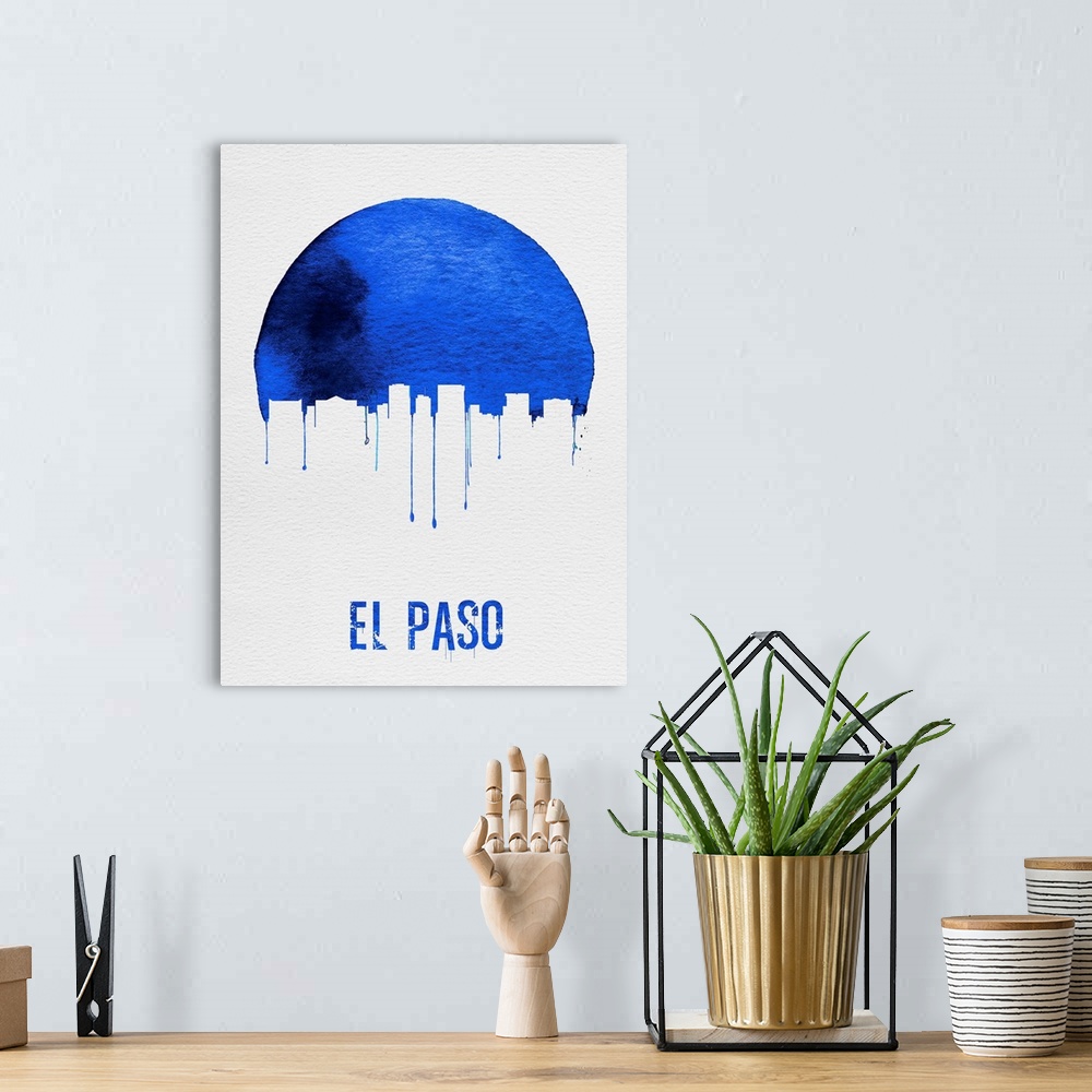 A bohemian room featuring Contemporary watercolor artwork of the El Paso city skyline, in silhouette.