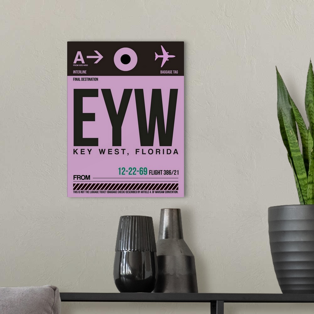 A modern room featuring EYW Key West Luggage Tag I