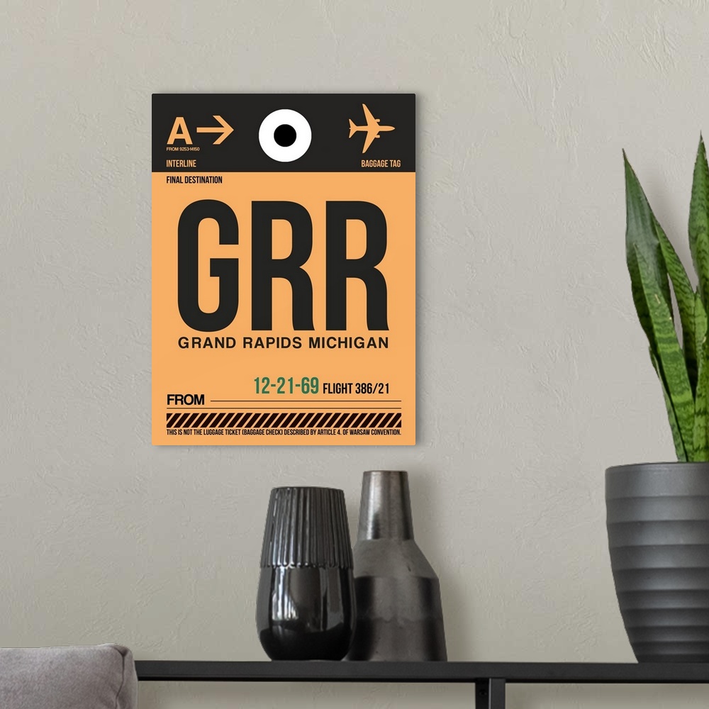 A modern room featuring GRR Grand Rapids Luggage Tag I