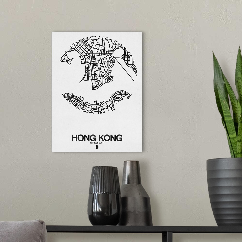 A modern room featuring Minimalist art map of the city streets of Hong Kong in white and black.