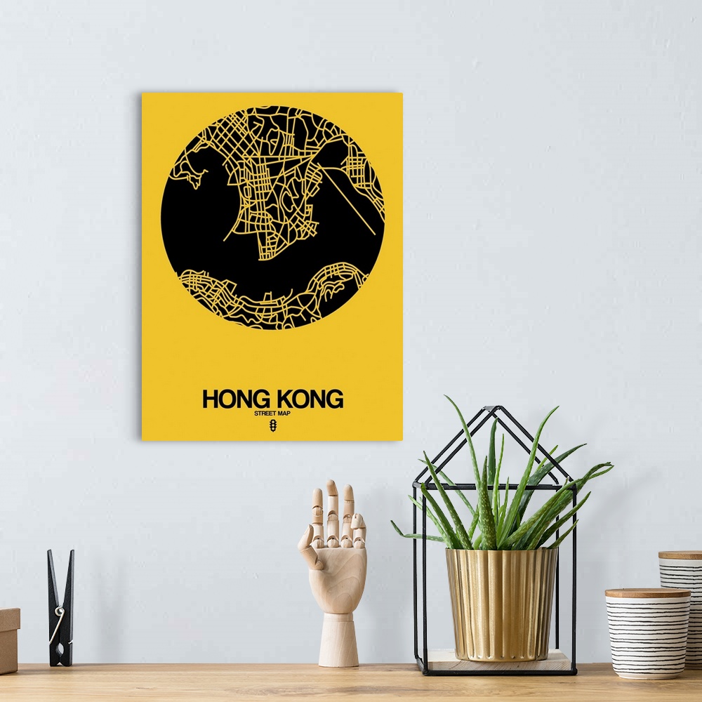 A bohemian room featuring Minimalist art map of the city streets of Hong Kong in yellow and black.