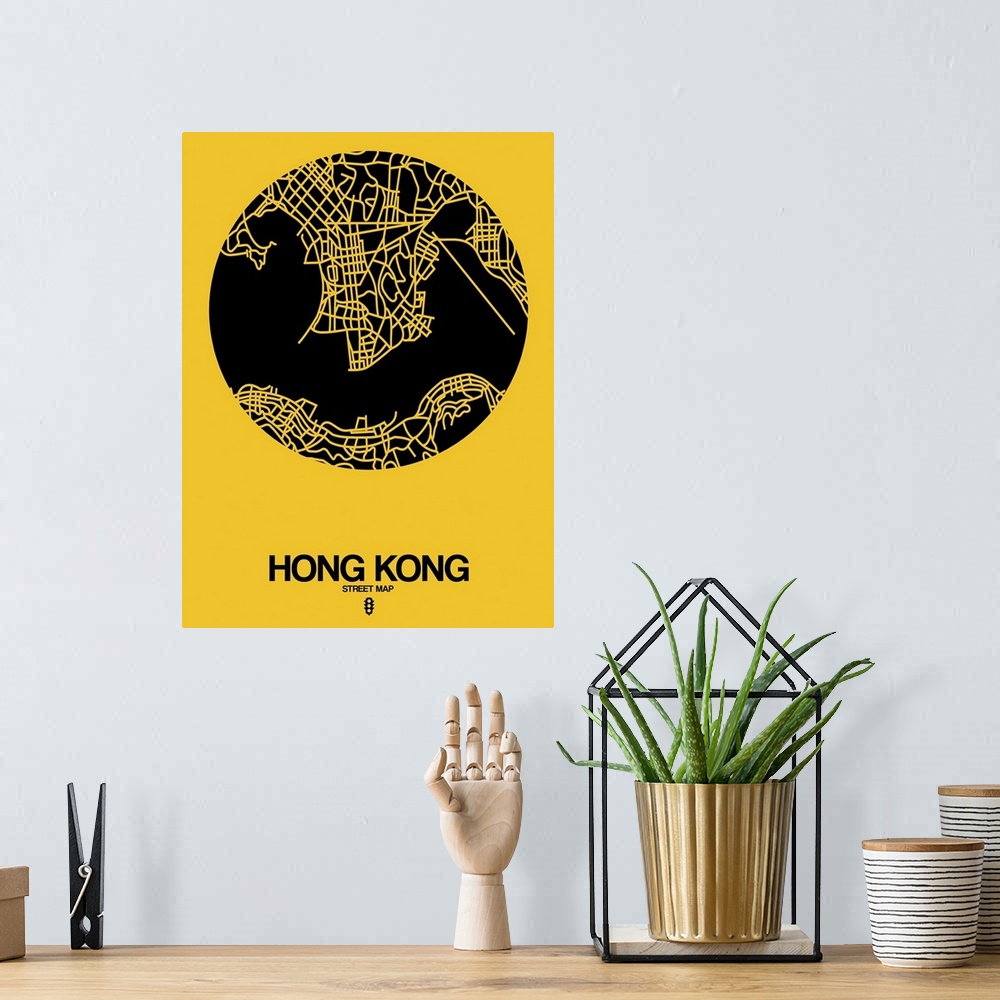A bohemian room featuring Minimalist art map of the city streets of Hong Kong in yellow and black.