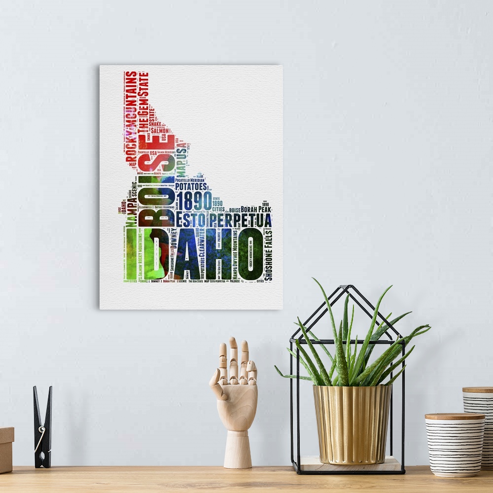 A bohemian room featuring Watercolor typography art map of the US state Idaho.