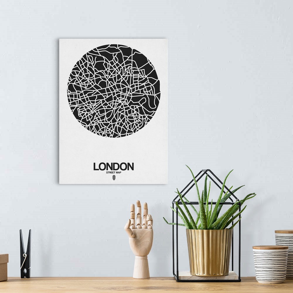 A bohemian room featuring Minimalist art map of the city streets of London in white and black.