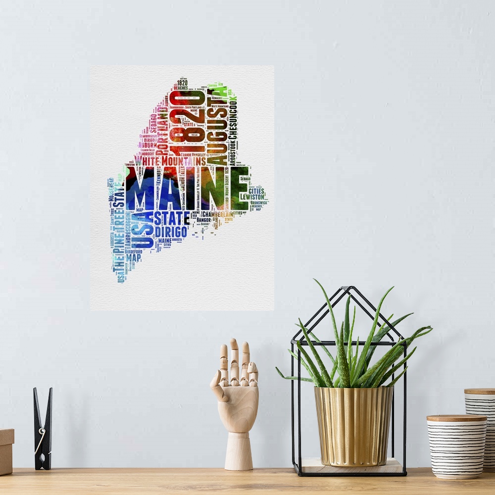 A bohemian room featuring Watercolor typography art map of the US state Maine.
