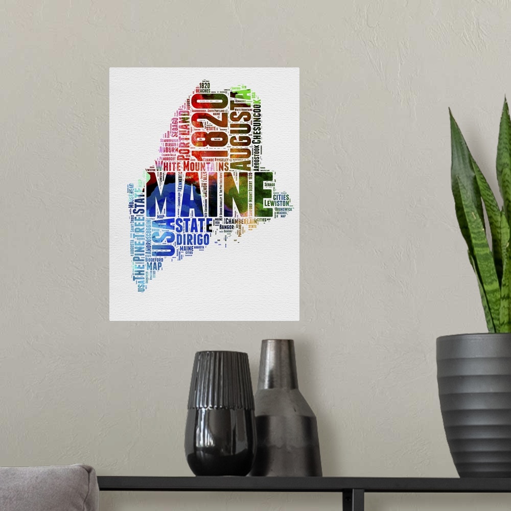 A modern room featuring Watercolor typography art map of the US state Maine.