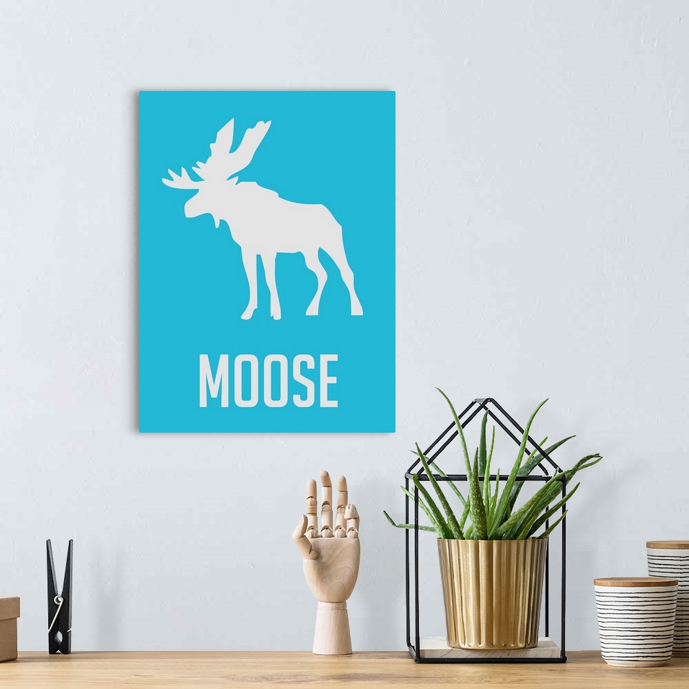A bohemian room featuring Minimalist Wildlife Poster - Moose - Blue
