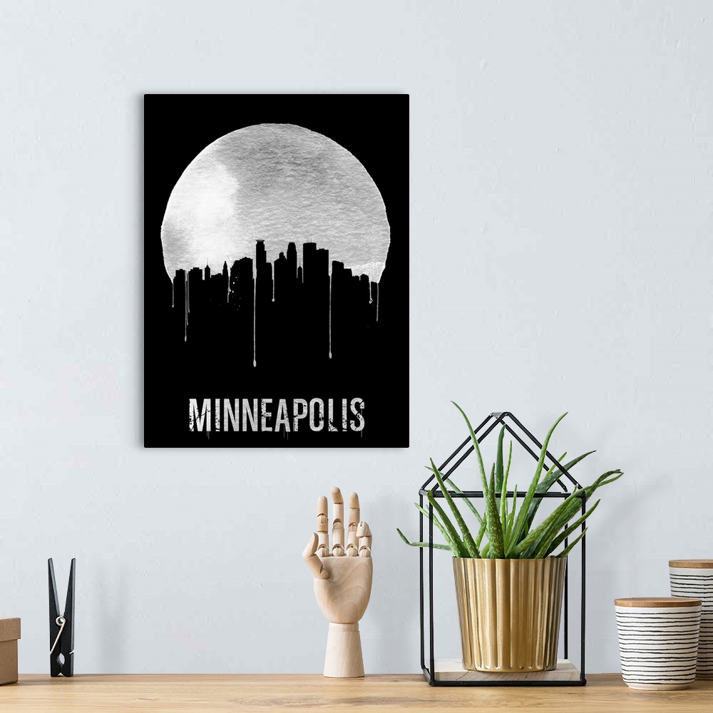 A bohemian room featuring Contemporary watercolor artwork of the Minneapolis city skyline, in silhouette.