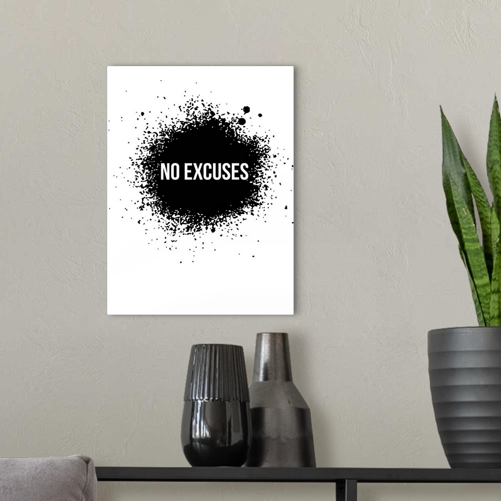 A modern room featuring Typography poster art using high contrast and paint splatter.